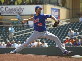 FILE - In this March 12, 2019, file photo, New York Mets pitcher Jacob deGrom (48) pitches during the first inning of a spring training baseball game against the Miami Marlins, in Jupiter, Fla. deGrom is expected to start Opening Day against the Washington Nationals.