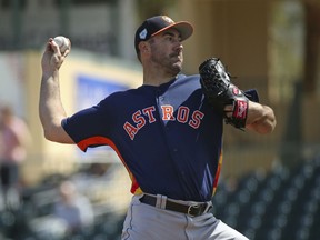 FILE - In this March 7, 2019, file photo, Houston Astros pitcher Justin Verlander throws during the first inning of a spring training baseball game against the Miami Marlins at the Roger Dean Chevrolet Stadium on Thursday, in Jupiter, Fla.