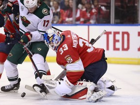 Minnesota Wild left wing Marcus Foligno (17) attempts to shoot at Florida Panthers goaltender Sam Montembeault (33) during the first period of an NHL hockey game, Friday, March 8, 2019 in Sunrise, Fla.