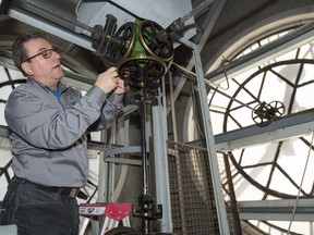 John Scott of Scotiabell prepares the tower clock for Daylight Savings time change at Fire Station No. 315 in Toronto on Saturday, March 9, 2019. Every spring and fall, John Scott climbs up clock towers across Toronto to change time.