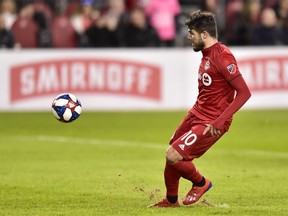 Toronto FC's Alejandro Pozuelo chips over the keeper to score on a penalty shot against New York City during second half MLS action in Toronto, Friday, March 29, 2019.