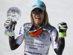 United States' Mikaela Shiffrin holds the women's World Cup slalom' discipline trophy, at the alpine ski, World Cup finals in Soldeu, Andorra, Saturday, March 16, 2019.