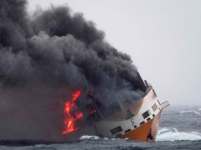 This photo provided on Thursday March 14, 2019 by the Marine Nationale, shows the Grimaldi vessel Grande America on fire in the Bay of Biscay, off the west coast of France, Monday March 11, 2019.