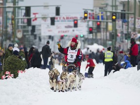 File - In this March 3, 2018, file photo, musher Aliy Zirkle runs her team during the ceremonial start of the Iditarod Trail Sled Dog Race in Anchorage, Alaska. The veteran musher is leading in Alaska's Iditarod Trail Sled Dog Race. She is seeking to become the first woman to win in nearly three decades. She was first to leave the Ophir checkpoint Wednesday, March 6, 2019, 432 miles into the race.