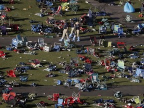 FILE - In this Oct. 4, 2017, file photo, agents from the FBI continue to process evidence at the scene of a mass shooting in Las Vegas. Accounts of police collecting bullet fragments and tracing the shooter's gun purchases are among newly released records from the Oct. 2017 deadliest mass shooting in modern U.S. history. The more than 750 pages of documents distributed Wednesday, March 20, 2019, by Las Vegas police don't provide new information about a reason for the carnage that killed 58 people and injured more than 850.