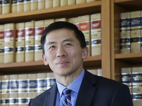 FILE - In this Jan. 13, 2017 file photo California Supreme Court Associate Justice Goodwin Liu pauses in his office in San Francisco. The California Supreme Court justice says the death penalty system in the most populous state is dysfunctional, expensive and doesn't deliver justice in a timely way.  Liu made the comments in an unusual opinion issued Thursday, March 28, 2019, after the full court unanimously upheld Thomas Potts' death sentence. Potts was convicted in a 1997 killing of an elderly couple.