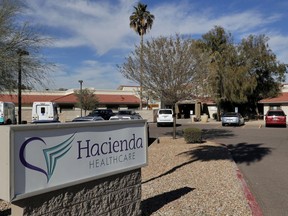 FILE - This Jan. 25, 2019, file photo shows the Hacienda HealthCare facility in Phoenix. A former top Phoenix prosecutor has quit an internal investigation into patient safety at a health care facility where an incapacitated woman was raped and later gave birth. Gov. Doug Ducey's office confirmed Friday, March 1, 2019, that former Maricopa County Attorney Rick Romley was terminating his contract with Hacienda HealthCare. The facility has been in turmoil since a patient gave birth Dec. 29.