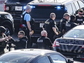 Marietta Police block southbound lanes on Interstate-75, near Marietta, Ga., North of Atlanta, Friday, March 29, 2019. Marietta police said in a brief statement that the southbound lanes of Interstate 75 were shut down Friday morning due to a armed motorist stopped on the freeway just northwest of Atlanta. Police described the motorist as a "non-compliant driver."