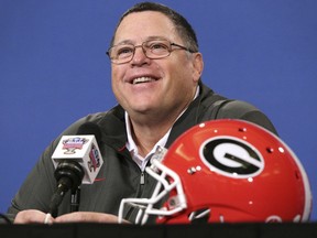 FILE - In this Dec 30, 2018, file photo, Georgia's offensive coordinator Jim Chaney takes questions during a news conference for the Sugar Bowl NCAA college football game against Texas in New Orleans. Tennessee is opening spring practice trying to rejuvenate an attack that ranked last in the Southeastern Conference in yards per game the last two years. The Vols have high hopes that new offensive coordinator Jim Chaney will help solve the problem after luring him away from Georgia with a lucrative deal.