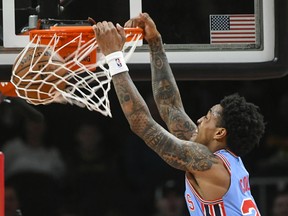 Atlanta Hawks forward John Collins dunks on the Brooklyn Nets during the first quarter of an NBA basketball game, Saturday March 9, 2019, in Atlanta.