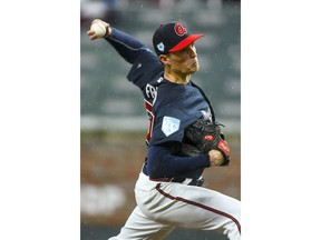 Atlanta Braves' Max Fried pitches during the first inning of an exhibition baseball game against the Cincinnati Reds, Monday, March 25, 2019, in Atlanta.