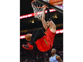 Atlanta Hawks center Alex Len dunks during the first quarter of an NBA basketball game against the Memphis Grizzlies, Wednesday, March 13, 2019, in Atlanta.