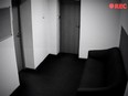 A camera records a picture of an empty hallway with doors. Korean authorities discovered the hidden cameras inside TV boxes, wall outlets and hair dryer stands in 42 hotel rooms, the National Police Agency said in a statement obtained by CNN.