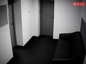 A camera records a picture of an empty hallway with doors. Korean authorities discovered the hidden cameras inside TV boxes, wall outlets and hair dryer stands in 42 hotel rooms, the National Police Agency said in a statement obtained by CNN.