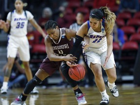 Missouri State guard Brice Calip, left, tries to control the ball as DePaul guard Sonya Morris, right, tries to steal during the first half of a first round women's college basketball game in the NCAA Tournament, Saturday, March 23, 2019, in Ames, Iowa.