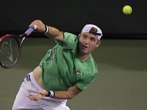 Bjorn Fratangelo serves to Novak Djokovic, of Serbia, at the BNP Paribas Open tennis tournament Saturday, March 9, 2019, in Indian Wells, Calif.