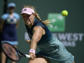 Angelique Kerber, of Germany, returns a shot to Bianca Andreescu, of Canada, during the women's final at the BNP Paribas Open tennis tournament Sunday, March 17, 2019, in Indian Wells, Calif.