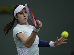 Christina McHale returns a shot to Venus Williams at the BNP Paribas Open tennis tournament Monday, March 11, 2019, in Indian Wells, Calif.