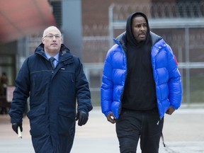 FILE - In this Monday, Feb. 25, 2019 file photo, R. Kelly walks out of Cook County Jail with his defense attorney, Steve Greenberg, after posting $100,000 bail, in Chicago. In his first interview since being charged with sexually abusing four people, including three underage girls, R. Kelly says he "didn't do this stuff" and he's "fighting for his life. Kelly gave the interview to Gayle King of "CBS This Morning," with excerpts airing Tuesday night, March 5, 2019, and the full interview airing Wednesday and Thursday morning.