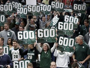 Michigan State fans celebrate head coach Tom Izzo's 600th win after an NCAA college basketball game against Ohio State in the quarterfinals of the Big Ten Conference tournament, Friday, March 15, 2019, in Chicago. Michigan State won 77-70.