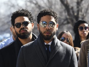 "Empire" actor Jussie Smollett, center, arrives at Leighton Criminal Court Building for a hearing to discuss whether cameras will be allowed in the courtroom during his disorderly conduct case on Tuesday, March 12, 2019, in Chicago. A grand jury indicted Smollett last week on 16 felony counts accusing him of lying to the police about being the victim of a racist and homophobic attack by two masked men in downtown Chicago.