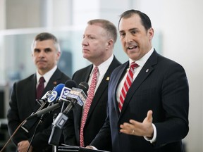 John R. Lausch Jr., U.S. Attorney for the Northern District of Illinois, center, briefs reporters on the trial of Floyd Brown in the killing of Special Deputy United States Marshal Jacob Keltner on Wednesday, March 20, 2019, U.S. District Courthouse in Rockford. Brown pleaded not guilty Wednesday to federal charges accusing him of fatally shooting Keltner, who was trying to serve an arrest warrant at a hotel.