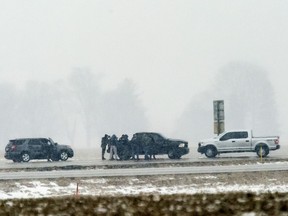 A police sharpshooter is in position where Illinois State Police and crisis negotiators are in a standoff with Floyd E. Brown, 39, of Springfield, on Interstate 55 near Lincoln, Ill. Thursday, March 7, 2019, after Brown allegedly shot a McHenry County sheriff's deputy attached to a U.S. Marshals Service task force in Rockford, then fled. His car was off the southbound lanes of the interstate and Brown was in and out of the car.
