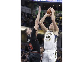 Indiana Pacers' Bojan Bogdanovic (44) shoots over Chicago Bulls' Zach LaVine (8) during the first half of an NBA basketball game Tuesday, March 5, 2019, in Indianapolis.