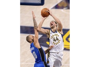 Indiana Pacers forward Bojan Bogdanovic (44) tries to get a shot off as he's defended by Orlando Magic guard Evan Fournier (10) during the second half of an NBA basketball game, Saturday, March 2, 2019, in Indianapolis. The Orlando Magic won 117-112.