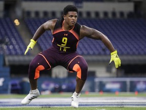 Michigan linebacker Devin Bush runs a drill at the NFL football scouting combine in Indianapolis, Sunday, March 3, 2019.