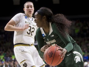 Michigan State's Victoria Gaines, right, drives by Notre Dame's Jessica Shepard (32) during a second-round game in the NCAA women's college basketball tournament in South Bend, Ind., Monday, March 25, 2019.