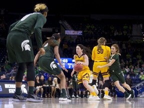 Central Michigan's Presley Hudson, center, drives in as Michigan State's Sidney Cooks (10) defends during a first-round game in the NCAA women's college basketball tournament in South Bend, Ind., Saturday, March 23, 2019. Michigan State won 88-87.