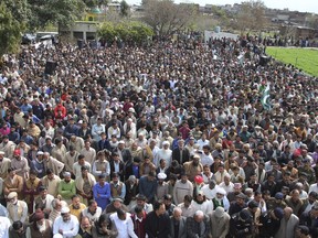 Mourners attend the funeral prayer of Pakistani prisoner Shakir Ullah, who was killed by Indian inmates in an Indian jail, in his native village near Sialkot, Pakistan, Sunday, March 3, 2019. Ullah was beaten to death by Indian inmates this month at an Indian jail apparently in retaliation for the Dec. 14, 2018 suicide bombing in Indian-controlled Kashmir.