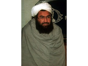 FILE - In this March 2, 2000 file photo, Masood Azhar, leader of Jaish-e-Mohammad, arrives at a reception in Rawalpindi, Pakistan. Pakistan has taken over the headquarters of Jaish-e-Mohammad, a militant group that claimed to have carried out a suicide bombing in Indian Kashmir that killed more than 40 Indian soldiers in February 2019, that brought nuclear-armed India and Pakistan to the brink of war.