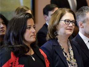 Jody Wilson-Raybould and Jane Philpott take part in a cabinet shuffle at Rideau Hall in Ottawa on Jan. 14, 2019, prior to both resigning from cabinet.