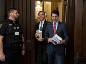 Prime Minister Justin Trudeau and Minister of Finance Bill Morneau arrive in the Foyer of the House of Commons to table the Budget, on Parliament Hill in Ottawa on Tuesday, March 19, 2019.