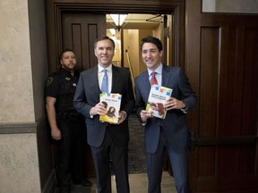 Prime Minister Justin Trudeau and Minister of Finance Bill Morneau arrive in the Foyer of the House of Commons to table the federal budget on Parliament Hill in Ottawa on Tuesday, March 19, 2019.