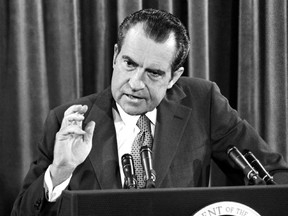 In this June 29, 1972, file photo, President Richard Nixon gestures during his news conference in Washington.