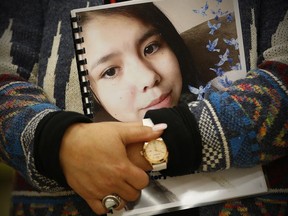 Sagkeeng councillor Marilyn Courchene holds the report as Daphne Penrose, the Manitoba Advocate for Children and Youth, releases a special report on the death of fifteen year old Tina Fontaine at a release event at the Sagkeeng Mino Pimatiziwin Family Treatment Centre on the Sagkeeng First Nation, Man., Tuesday, March 12, 2019.