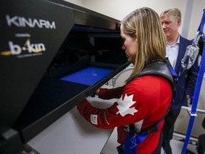 Dr. Brian Benson, right, tests Olympic wrestler Danielle Lappage following the announcement of comprehensive guidelines for concussions in high performance sport in Calgary, Alta., Monday, March 18, 2019.THE CANADIAN PRESS/Jeff McIntosh