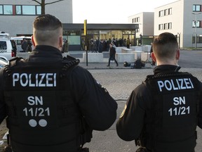 Police Officers stand in front of the court entrance prior the beginning of the trial against Alaa S. of Syria in the higher regional court in Dresden, Germany, Monday, March 18, 2019. The asylum seeker is accused together with now fugitive Iraqi asylum-seeker of having killed 35-year-old Daniel H. in Chemnitz on Aug. 26, 2019.
