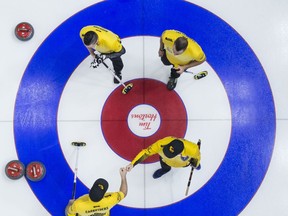 Team Manitoba lead Colin Hodgson, second Derek Samagalski, third Reid Carruthers and skip Mike McEwen celebrate their win over Team Newfoundland and Labrador following the 9th draw at the Brier in Brandon, Man. Tuesday, March 5, 2019.