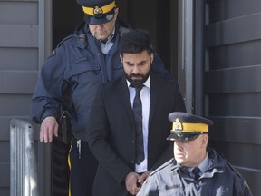 Jaskirat Singh Sidhu is taken out of the Kerry Vickar Centre by the RCMP following his sentencing for the Humboldt Broncos bus crash in Melfort, Sask., on Friday, March, 22, 2019.