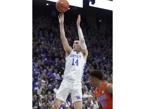 Kentucky's Tyler Herro (14) shoots near Florida's Noah Locke (10) during the first half of an NCAA college basketball game in Lexington, Ky., Saturday, March 9, 2019.
