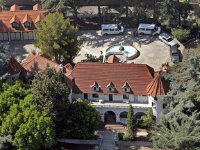 FILE - This Aug. 9, 2007 file photo shows music producer Phil Spector's mansion on Grand View Drive in Alhambra, Calif. The hilltop Los Angeles-area mansion where Spector killed actress Lana Clarkson in 2003 is for sale at $5.5 million. The chateau known as "Pyrenees Castle" sits on 2.5 acres (1 hectare) in Alhambra. Spector is serving 19 years to life after his murder conviction in Clarkson's death, found shot to death in the foyer of the 8,700-square-foot (808-square-meter) home.