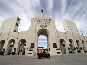 FILE - This Jan. 13, 2016 file photo shows the peristyle of the Los Angeles Memorial Coliseum in Los Angeles. The University of Southern California's sale of naming rights for Los Angeles Memorial Coliseum is being criticized as dishonoring the historic stadium's dedication as a memorial to soldiers who fought and died in World War I. USC announced last year that the stadium will be renamed United Airlines Memorial Coliseum as part of a $270 million renovation of the facility, which opened in 1923.
