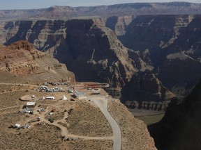 In this March 20, 2007, file photo, the Skywalk hangs over the Grand Canyon on the Hualapai Indian Reservation before its grand opening ceremony at Grand Canyon West, Ariz.