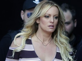 FILE - In this Oct. 11, 2018, file photo, adult film actress Stormy Daniels arrives at the adult entertainment fair "Venus" in Berlin. A federal judge has thrown out a lawsuit against President Donald Trump by porn actress Stormy Daniels that sought to tear up a hush-money settlement about their alleged affair. Judge S. James Otero ruled Thursday, March 7, 2019, in U.S. District Court that the suit was irrelevant after Trump and his former personal lawyer agreed to rescind a nondisclosure agreement Daniels signed in exchange for a $130,000 payment.