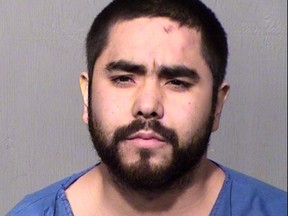 In this photo released Saturday, March 23, 2019, by the Maricopa County Sheriff's Office shows suspect Fernando Acosta. The 25-year-old Arizona man who was driving a San Diego-area woman's car is accused of fatally stabbing her after the vehicle veered off a freeway and crashed in a Phoenix suburb, resulting in a chaotic scene involving passers-by who stopped to help. (Maricopa County Sheriff's Office via AP)