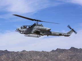 In this April 17, 2017 photo released by U.S. Marine Corps, an AH-1Z Viper prepares to land at the Chocolate Mountain Aerial Gunnery Range, Calif. A statement from the Marine Corps Air Station posted on Facebook Saturday, March 31, 2019, says two pilots have died on an AH-1Z Viper helicopter crash, while conducting a routine training mission near Yuma, Ariz. The accident occurred at about 8:45 p.m. Saaturday.